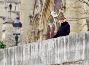 As I traveled down the seine that Sunday, on the boat I imagine that was Ernest Hemingway looking down to see if I enjoyed Paris. He was on the bridge along Notre Dame Cathedral. Photo by Willie Brown 